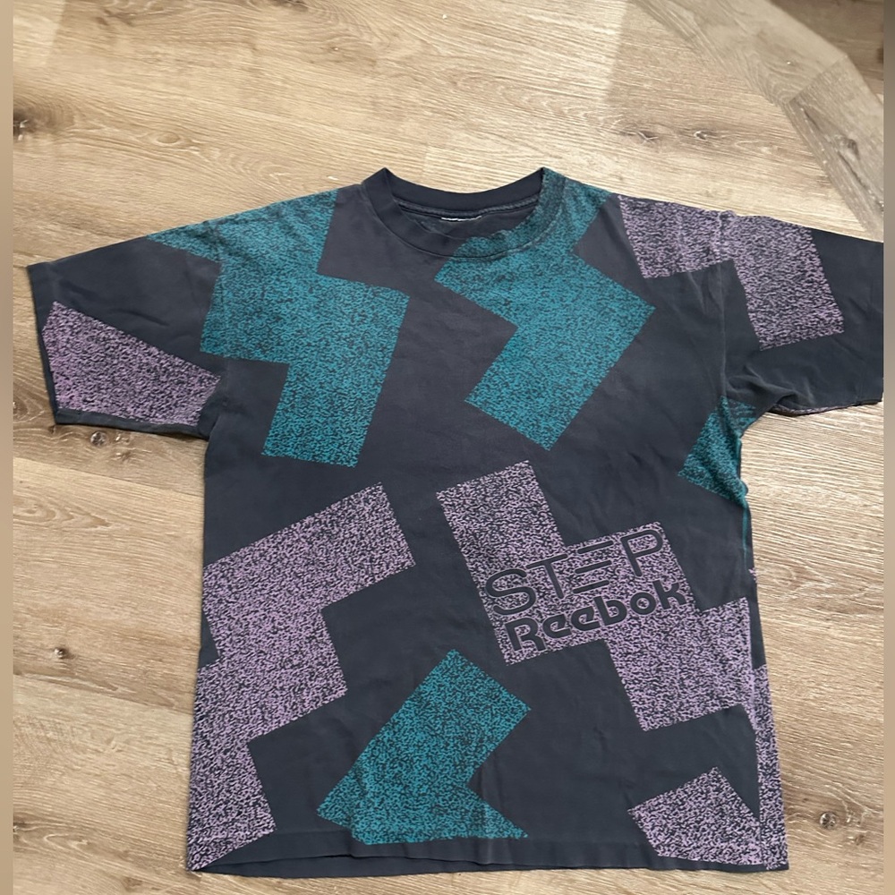 Vintage 90’s Reebok Step T-Shirt in Black and Teal. Approximately XL